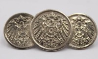 Auktion 373<br>Brosche aus 2 x 1 Reichspfennig um 1906 und 1x 2Reichspfennig  , versilbert .