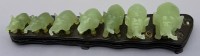 Auktion 373 / Los 15533 <br>Jade Elefantenbr&uuml;cke mit 7 Elefanten auf Holzstand, H-ca. 6 cm, B-25 cm