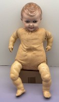Auktion 373 / Los 12092 <br>gr. Masse Jungenpuppe mit Stoffk&ouml;rper, sitzend, H-53 cm, bespielt