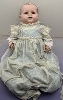 Auktion 373 / Los 12105 <br>Tortulon Babypuppe in Taufkleid, nur Germany gemarkt, L61 cm, Stoffk&ouml;rper