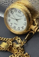 Auktion 374<br>Quartz Taschenuhr "Eclipse" Japan Movt, neuwertig mit Kette, goldfarben, D-4,5 cm, Vorderseite mit orig. Schutzfolie