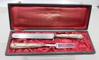 Auktion 374<br>Gabel und Messer, 19. Jhd., Silbergriffe gepr., in Etui, ca. L-24,5cm