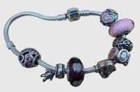 Auktion 374<br>Silber-925- Pandora Armband mit 8 Charms, zus. ca. 42,86 gr