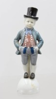 Auktion 375<br>Figur, Knabe mit Zylinder, &auml;lter, Unterglasurfarben, ca. H-17cm