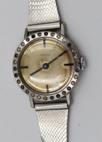 Auktion 376<br>Vintage-Damenarmbanduhr, Heno, Handaufzug, Werk l&auml;uft , L&uuml;nette mit klaren Steinen, ca. D-2,5cm, getragene Erhaltung