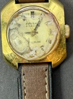 Auktion 376<br>vintage mechan. DAU "Prisma" Amazone, Werk l&auml;uft, Glas verklebt mit?? , einen Teil habe ich bereits abgekratzt