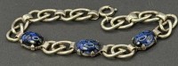Auktion 376<br>massive Silber-835- Armband mit 3 blau marmorierten Steinen (1x gerissen), L-20,5 cm, 20,44 gr