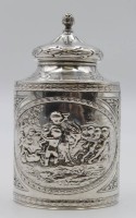 Los 4013 <br>schöne Teedose, Silber, ungedeutete Punzierungen, Reliefdekor, Knaben mit Ziegenbock, ca. 150gr., H-12,4cm.