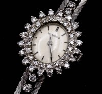 Auktion 339 / Los 2115 <br>Damen Armbanduhr Jaeger LeCoultre, WG 0.750 mit Diamanten, mechanisch, Werk läuft, Diamanten zus.ca. 1,80ct. ges. Gew. 28g.