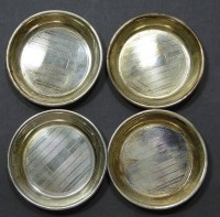 4 Silberuntersetzer oder Ähnliches, Sterling, 6,5 cm, H. 1 cm, zus. 53 gr., kleine Kratzer, reinigngsbedürftig