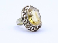 Auktion 332 / Los 1015 <br>835er Silber Ring mit einen oval facc. gelben Farbstein, 5,3g., RG 53