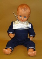 Auktion 331 / Los 12048 <br>Celluloid Puppe mit Schlafaugen, Mammastimme, Ferse beschädigt, H-45 cm