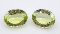 Auktion 332 / Los 1002 <br>2 Lemon Citrine, Ovalschliff, 94,55 ct. und 86,7 ct., 3,3 x 2,5 x 1,8 cm und 2,5 x 3,3 x 1,6 cm