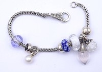 Auktion 333 / Los 1030 <br>LAA Armband mit Charms, Sterling Silber 0.925 L. 20cm, 28,8g.