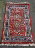 Auktion  / Los  <br>Wollteppich, 67x115 cm