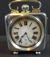 Auktion 334 / Los 2018 <br>Silber-Taschenuhrengehäuse in Weckerform, S-925-, Birmingham 1910, innen grosse Taschenuhr, Werk läuft, Innendeckel "Argentan" beschriftet, 11x8 cm, Uhr D-7 cm