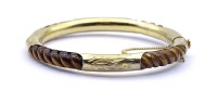 Auktion 500016 / Los  <br>Tigeraugen Armspange, goldfarbene Monturen