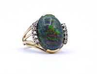 Auktion 337 / Los 1001 <br>Opal Goldring 585/000 mit 10 Brillanten zus. 0,10ct., 6,3g., RG 53, Opal ca. 19x 14mm