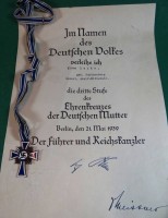Auktion 338 / Los 7041 <br>Mutterkreuz am Band mit Urkunde