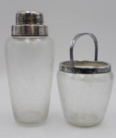 Auktion 338 / Los 10011 <br>Barshaker und Eisbehälter, Eisglas mit versilberten Monturen diese WMF, Shaker H-21cm.