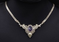Auktion 339 / Los 1000 <br>Halskette mit einem oval facc. Amethyst, Silber 925 + Gold 18K, L. 45,5cm, 26,3g.