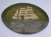 Auktion 339 / Los 4018 <br>kl. ovales Gemälde auf Holz "Segelschiff Seute Deern" Bremen, unleserl. signiert, verso Zettel mit Unterschriften der Besatzung während der Hafen-Liegezeit 1990, 24x34 cm