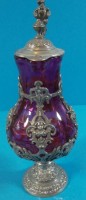 Auktion 339 / Los 10021 <br>kl. Weinkännchen, lila Glas und Zinnmontur, H-16 cm