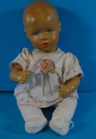 Auktion 340 / Los 12047 <br>Käthe Kruse Babypuppe, orig. Etikett, H-29 cm