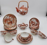 Auktion 341 / Los 15503 <br>Teeservice, Japan, für 6 Personen, Tassen mit Geisha-Kopf, Milchkännchen fehlt, Kanne H-13cm, Tassen H-5cm.