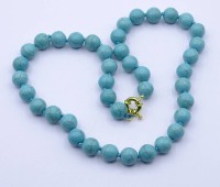 Los 1038 <br>t&uuml;rkisfarbene Halskette mit goldfarbener Montur, L. 46cm