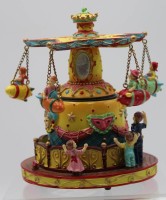 Los  <br>Kettenkarussell mit Spieluhr, Kunstmasse, 2x beschädigt, Werk läuft, H-16,5cm.