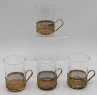 Auktion 500017 / Los  <br>4x Teeglashalter, Kupfer/Messing, mit Gläsern, ca. H-10cm.