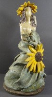 Auktion 344 / Los 9008 <br>Erna BINZ (1914-2008), Fayence Figur "Frau mit  Sonnenblumen", H-42 cm, 5 kg,