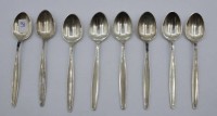 Auktion 366<br>8x Mokkal&ouml;ffel, Georg Jensen, Cypress, 925er Silber, zus. 118,7gr., L-11cm.