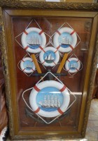 Auktion 364<br>gr. Schaukasten mit Darstellungen verschiedener Segelschiff-Typen in Rettungsringen, hinter Glas, RG 100x65 cm