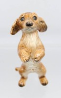 Auktion 355 / Los 9058 <br>Hundefigur von Goebel, Unterglasurfarben, ca. H-12cm,