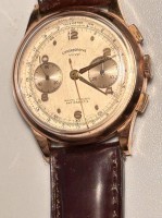 Auktion 358 / Los 2126 <br>Armbanduhr  "Chronographe Suisse", Gelbgoldgehäuse -750-, Lederband, Werk läuft, guter Zustand