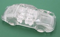 Auktion 359 / Los 10001 <br>Porsche aus farblosem Glas, Briefbeschwerer, ca. H-4,8cm L-16cm