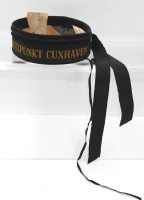 Auktion 361<br>Teil einer Marinemütze mit Mützenband "Stützpunkt Cuxhaven", ca. D-19cm