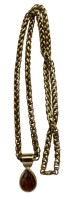 Auktion 363 / Los 1008 <br>Pierre Lang Anhänger vergoldet mit schwerer Double- Kette, L-ca. 70  cm. Anhänger 3,4 cm, brauner Stein