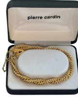 Auktion 363 / Los 1036 <br>Goldfarbenes Armband "Pierre Cardin" neu in Kasten, L-20 cm, mit Schloß, 26,8 gr., vintage