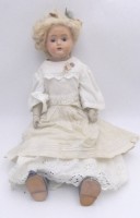 Auktion 363 / Los 12027 <br>Mädchenpuppe, Massekopf (Wange mit Riss) und Lederkörper, H-54 cm, wohl unter geklebter Perücke gemarkt