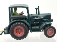 Auktion 363 / Los 12047 <br>Hanomag Traktor mit Leiterwagen und Fahrerfigur "Siku", 1:32?