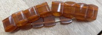 Auktion 371<br>Bernstein Zugarmband, braun, 22,8 gr-. Band muss erneuert werden