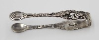 Auktion 364 / Los 11010 <br>Zuckerzange, 800er Silber, Puttodarstellung, 21,3gr., L-10cm