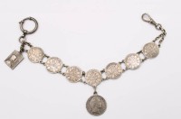 Auktion 364<br>Uhrenkette gefertigt aus Münzen, 50 Pfennige von 1877 sowie  1/2 Gulden von 1844, ca. L-27cm