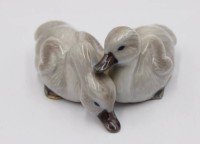 Auktion 365 / Los 8024 <br>Paar Jungschwäne, Royal Copenhagen, leicht staffiert, Modellnr. 363, H-4,8cm T-10cm