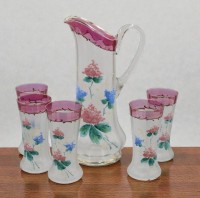 Auktion 366<br>sch&ouml;nes Saftset um 1900-1920, florale Emaillemalerei, Krug mit 5 Gl&auml;sern, ca. H-31,5cm und 16cm, 1 Glas mit Chip