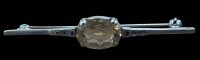Auktion 366<br>Silbernadel mit gelben Stein,  B-6 cm, 4,3 gr.