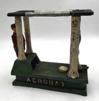 Auktion 366<br>Hubley"Acrobat Bank"  gusseiserne Spardose mit Turner, wohl alt, 